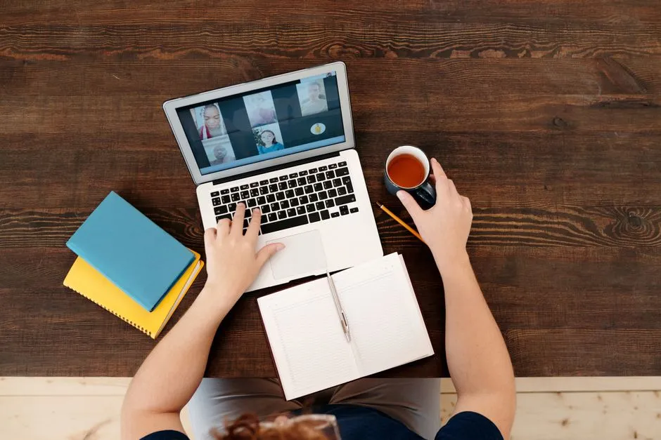 Two teammates enjoying a virtual coffee chat - remote work culture activities