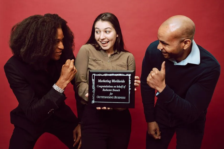 happy diverse team celebrating recognition achievements - employee rewards and recognition software