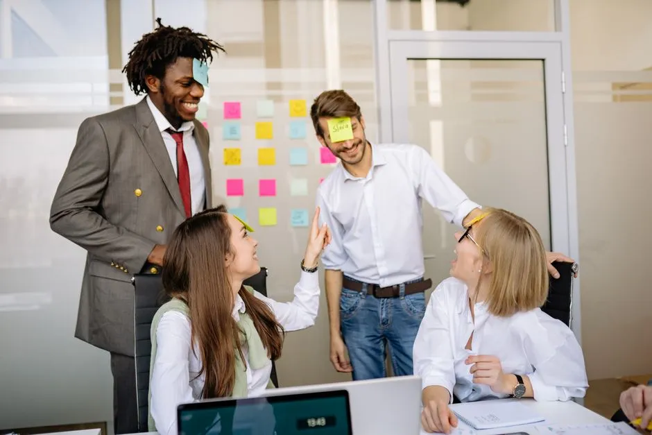 A team laughing during a silly trophy presentation ceremony - office fun awards