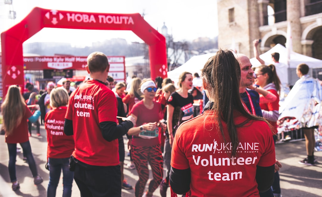 Employees participating in a company-sponsored charity run - csr initiatives for employees