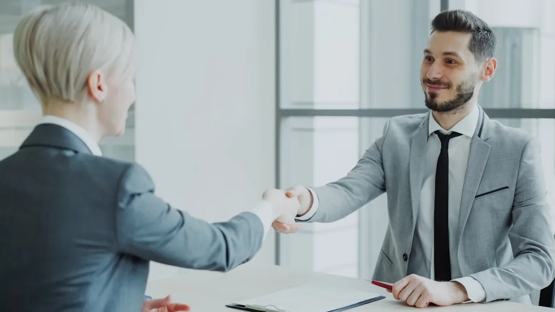 manager and employee in positive meeting - hr employee survey